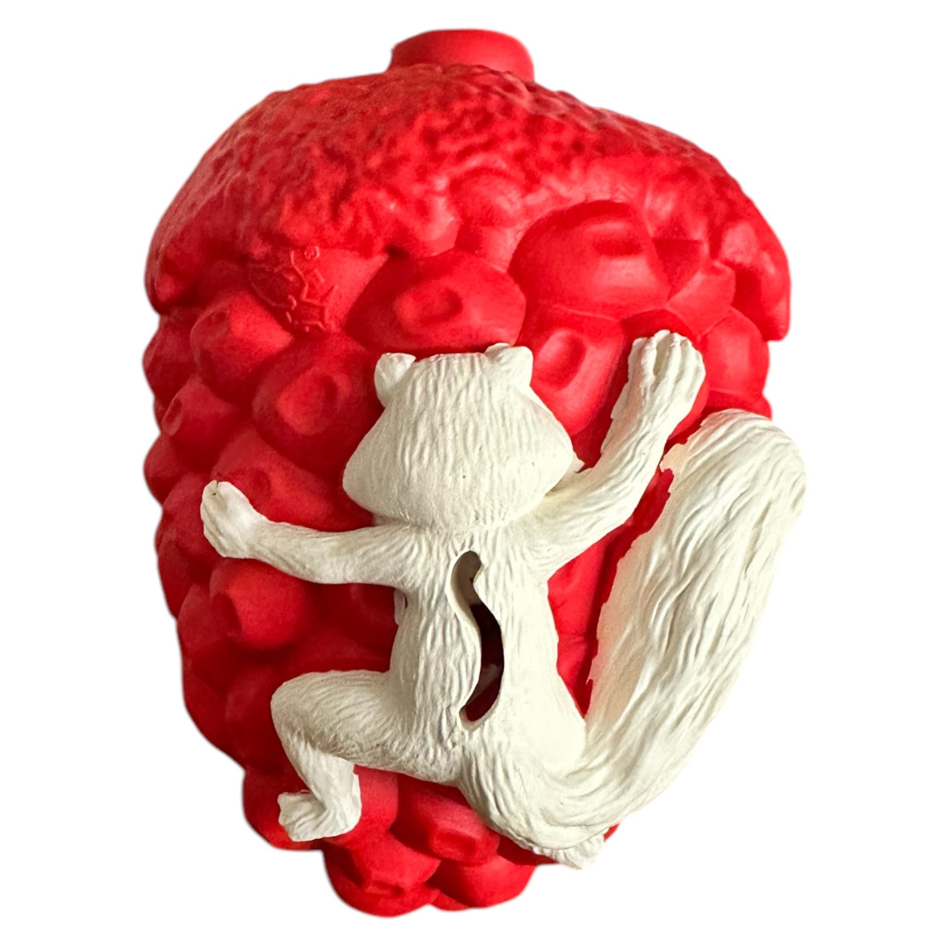 Acorn tough rubber dog toy in red with a white squirrel that is suitable for strong chewers