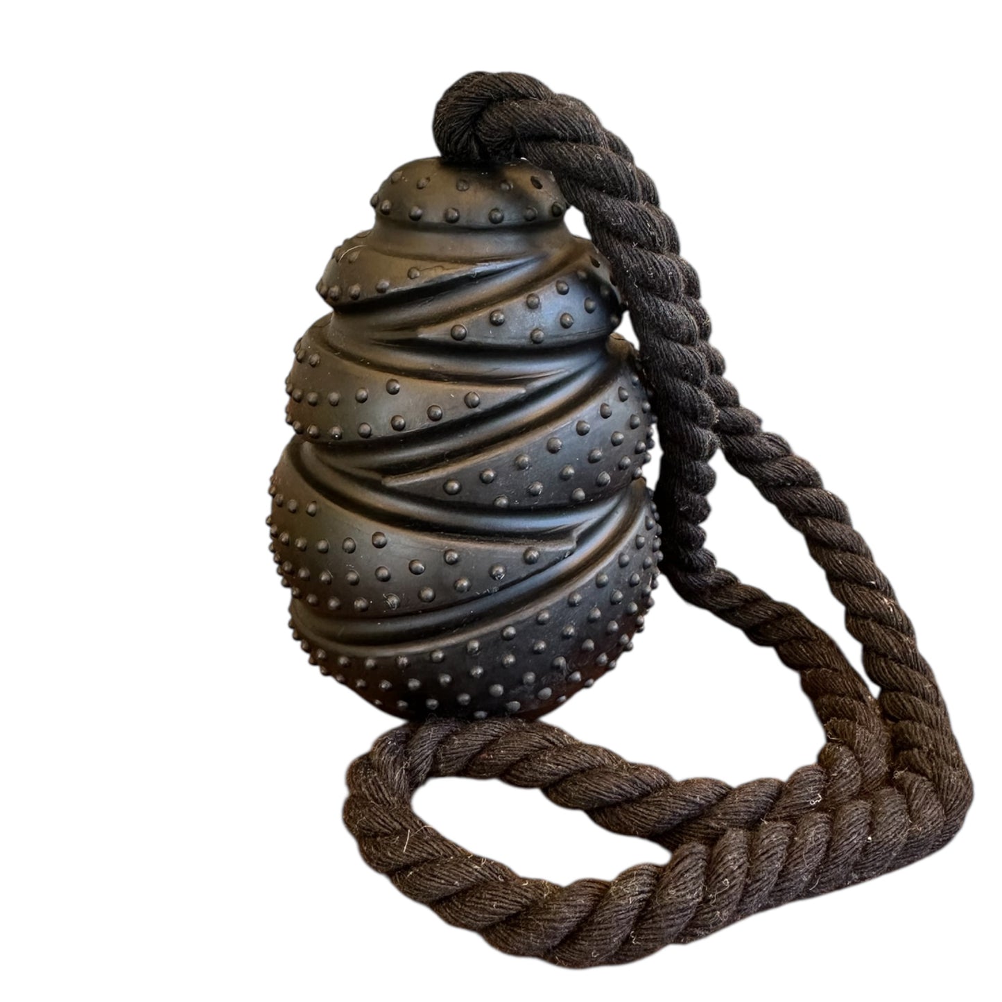 Black textured toy with a rope on a white background