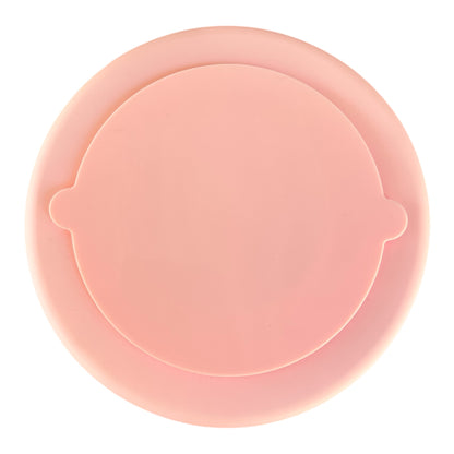Bottom of Pink silicone slow feeder bowl on a white background