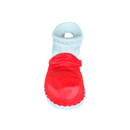 Red and white dog chew toy in the shape of a shoe that is made from strong and sustainable natural rubber.
