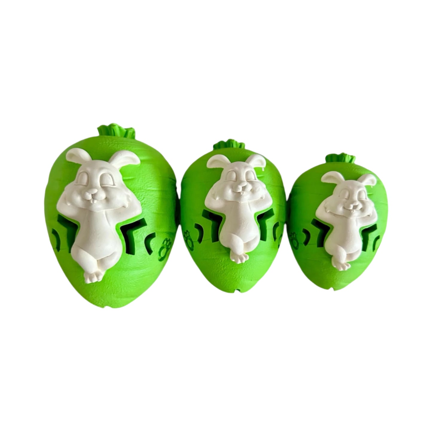 Three rubber carrot and bunny dog chew toys in green and while