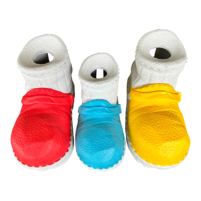 Multiple natural rubber chew toys shaped like boots for tough dogs.