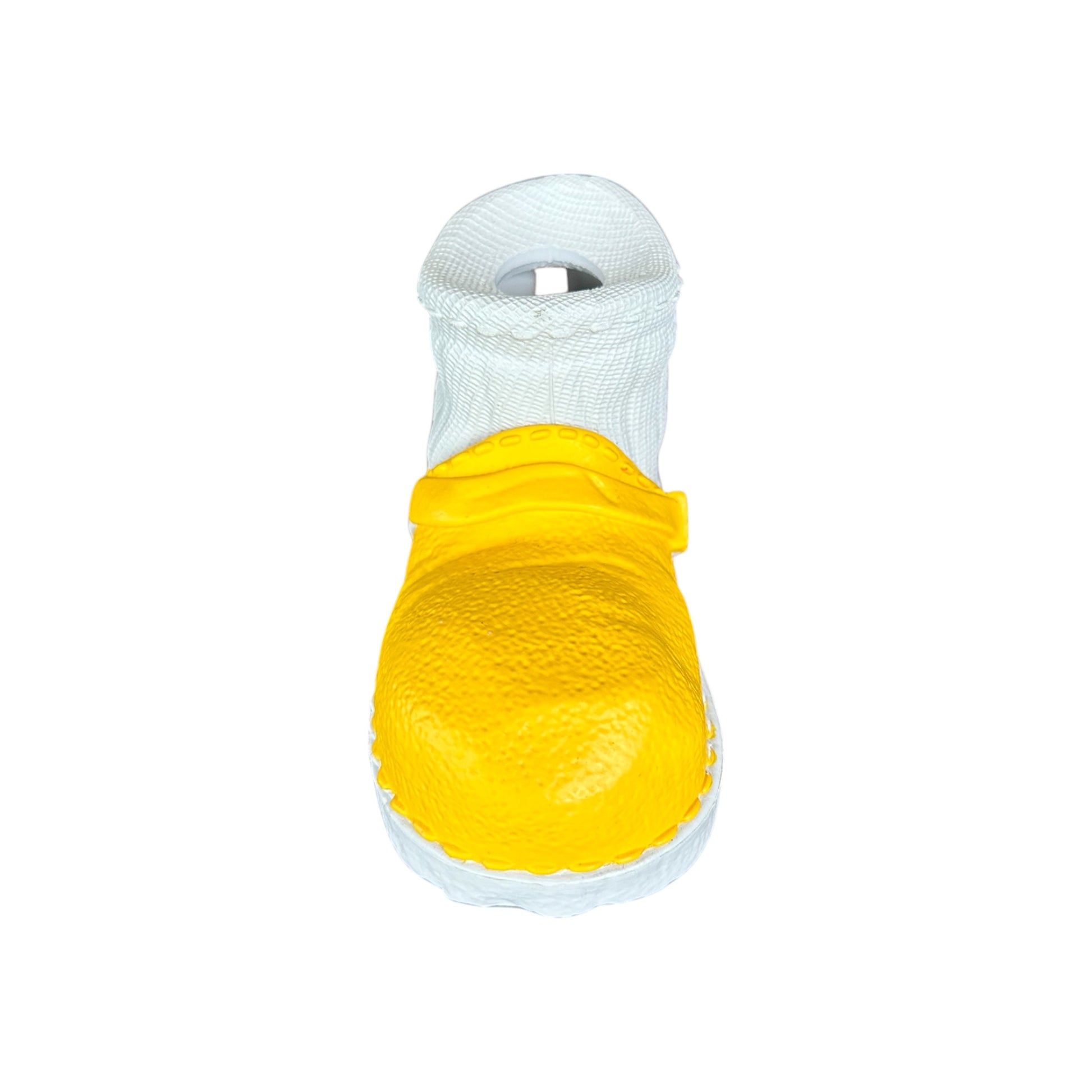 Tough rubber dog toy in the shape of a yellow and white shoe.